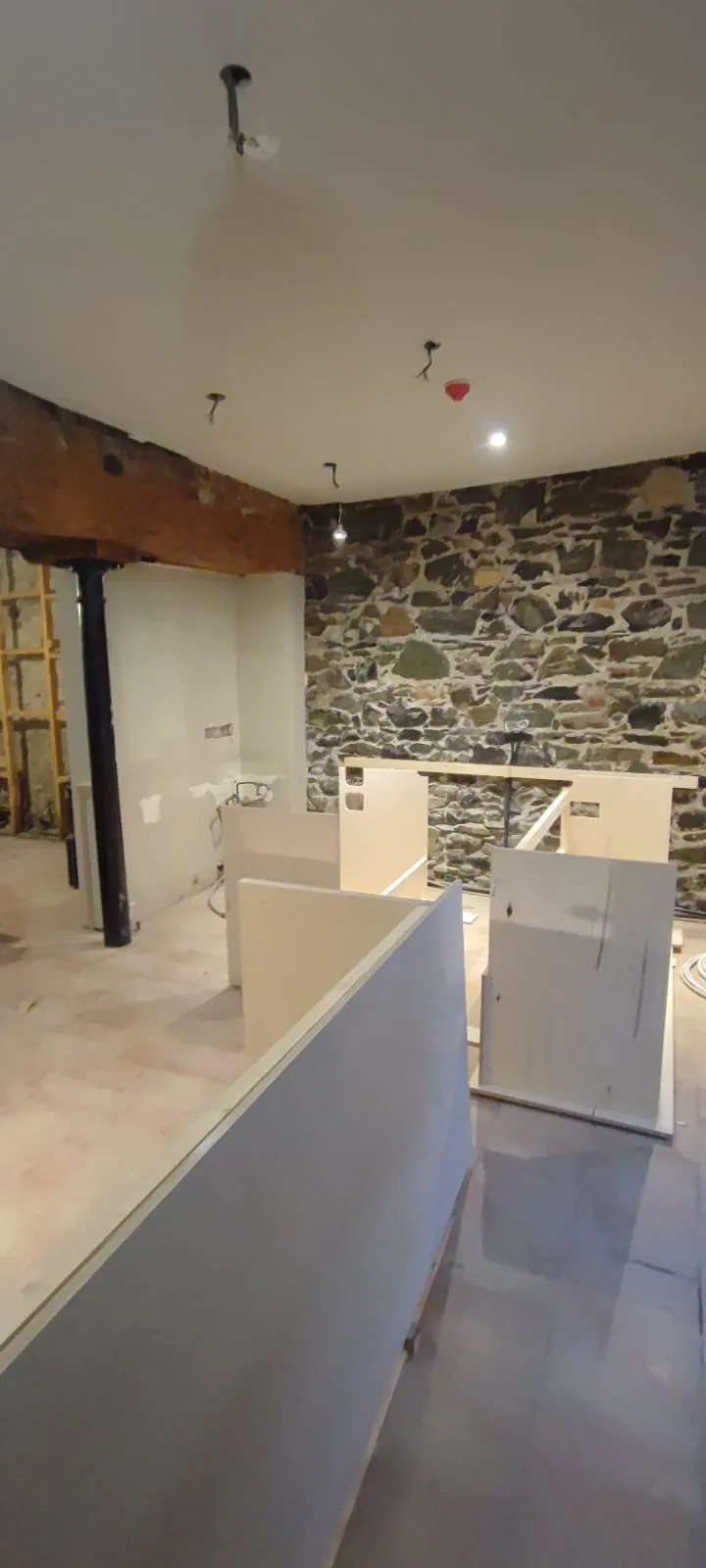 Live edge oak bar top and fitted shelving in a Carlingford pub interior, made by Setanta Woodcraft